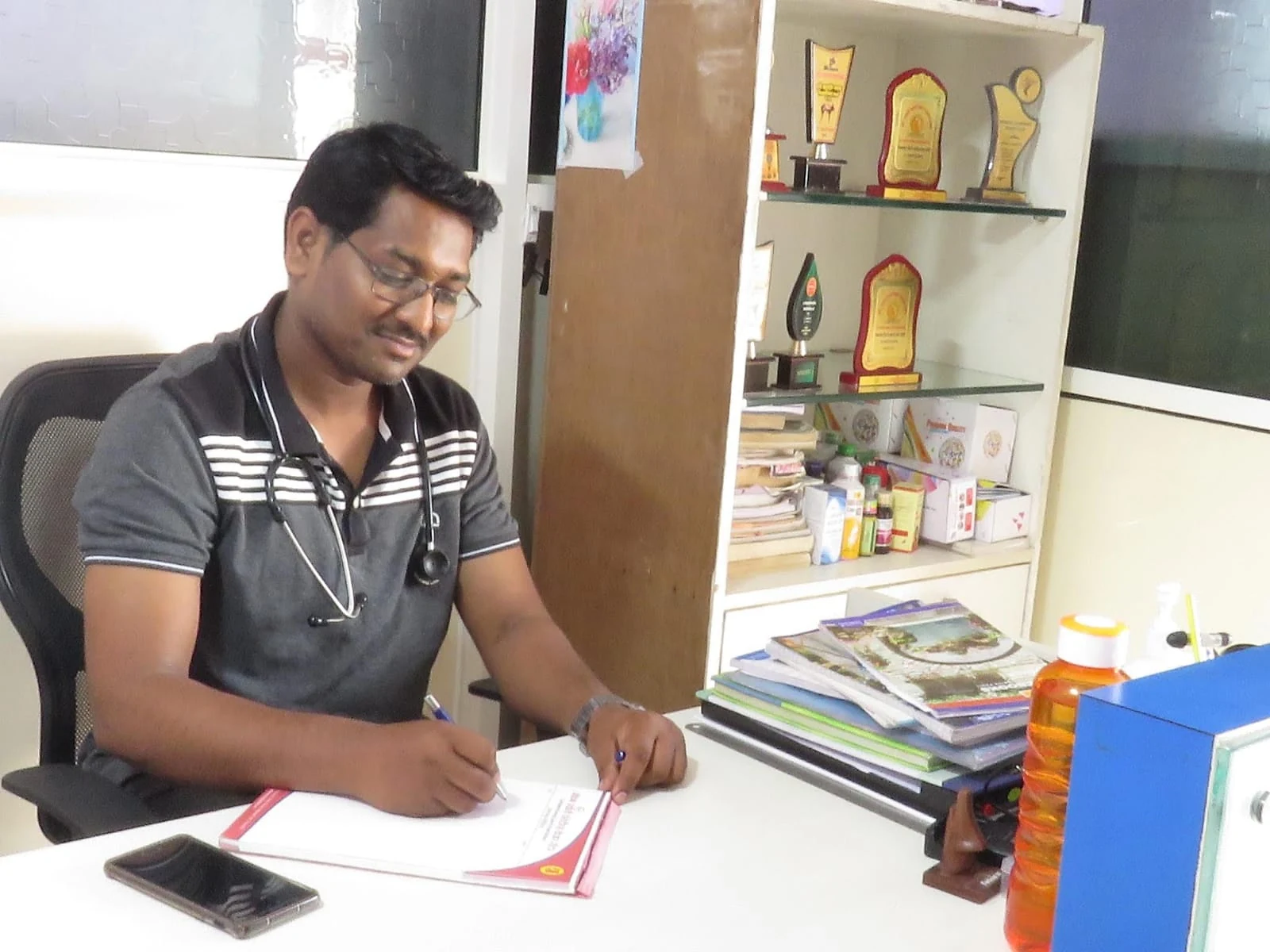 Care team member reviewing notes at Jeevan Jyoti in Manjari