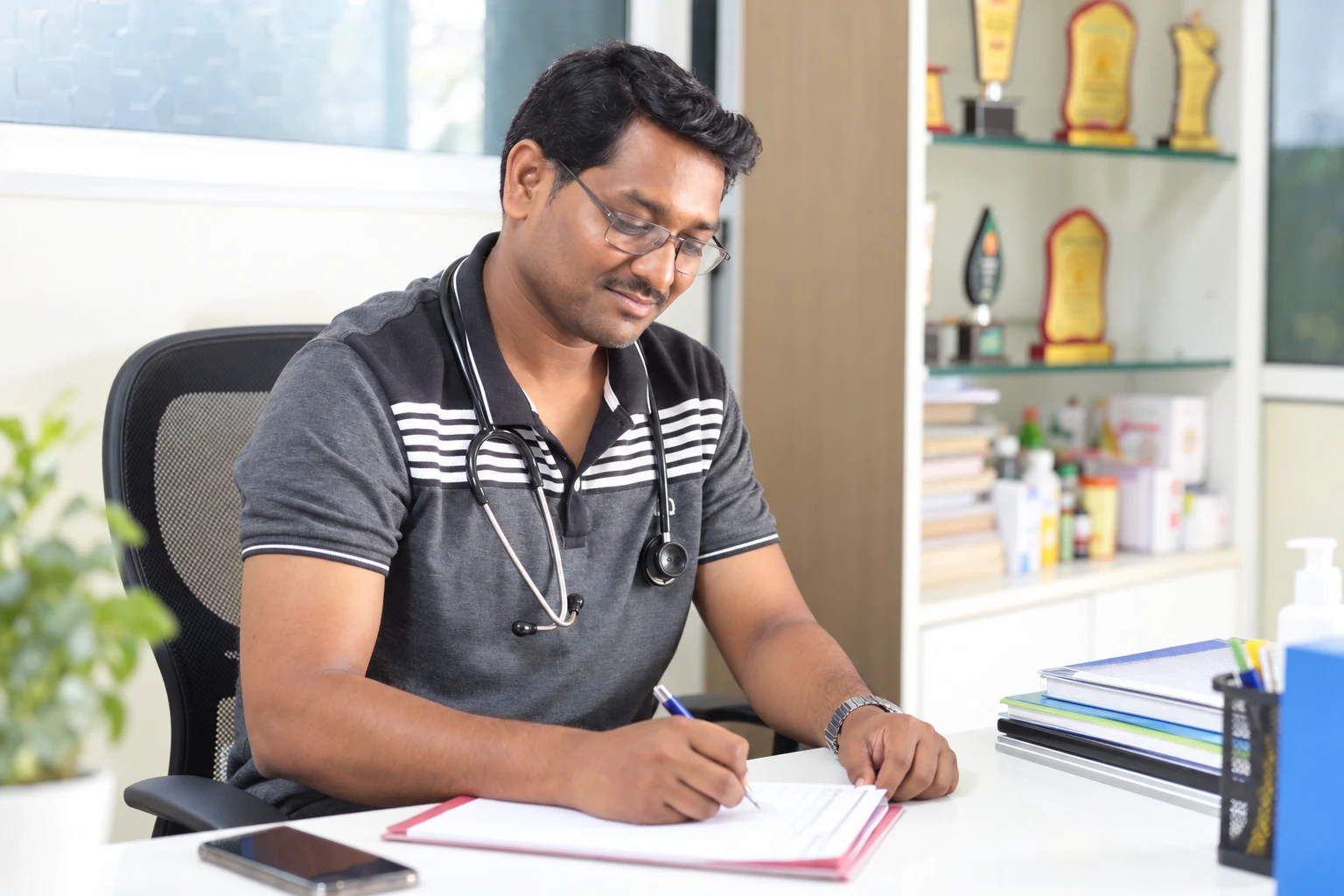 Portrait based on a photograph of a Jeevan Jyoti care team member seated with a stethoscope