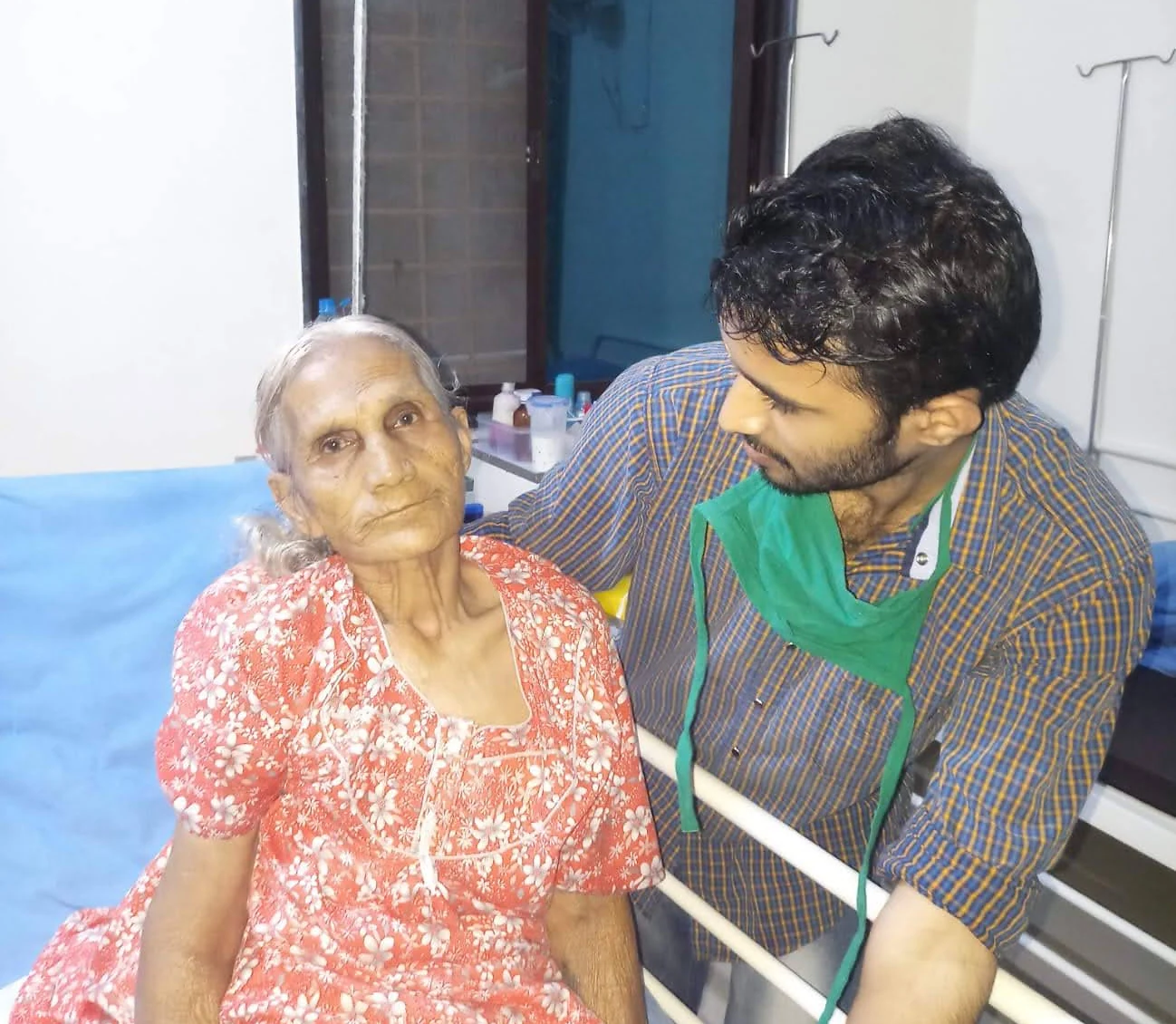 An older woman with a companion beside her at Jeevan Jyoti