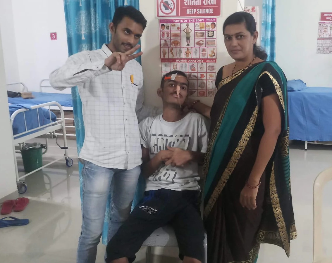 Three people together in a care room at Jeevan Jyoti